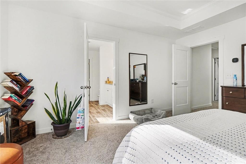 31 Breckens Way Statham, GA 30666 - Photo 14 of 24 a bedroom with a bed and potted plant