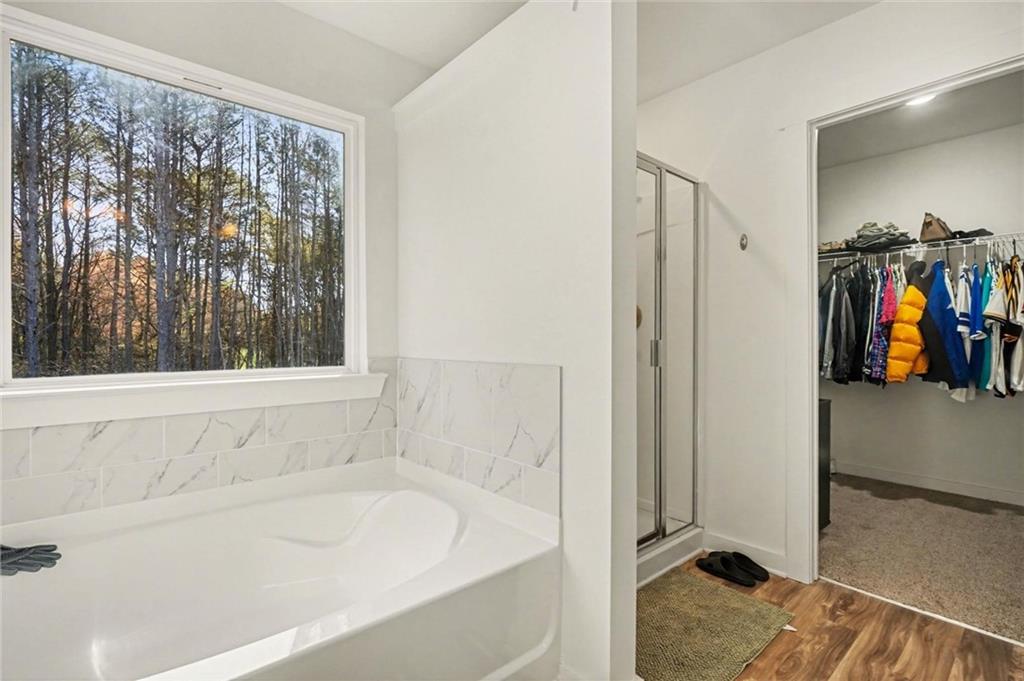 31 Breckens Way Statham, GA 30666 - Photo 17 of 24 a bathroom with a tub and a window