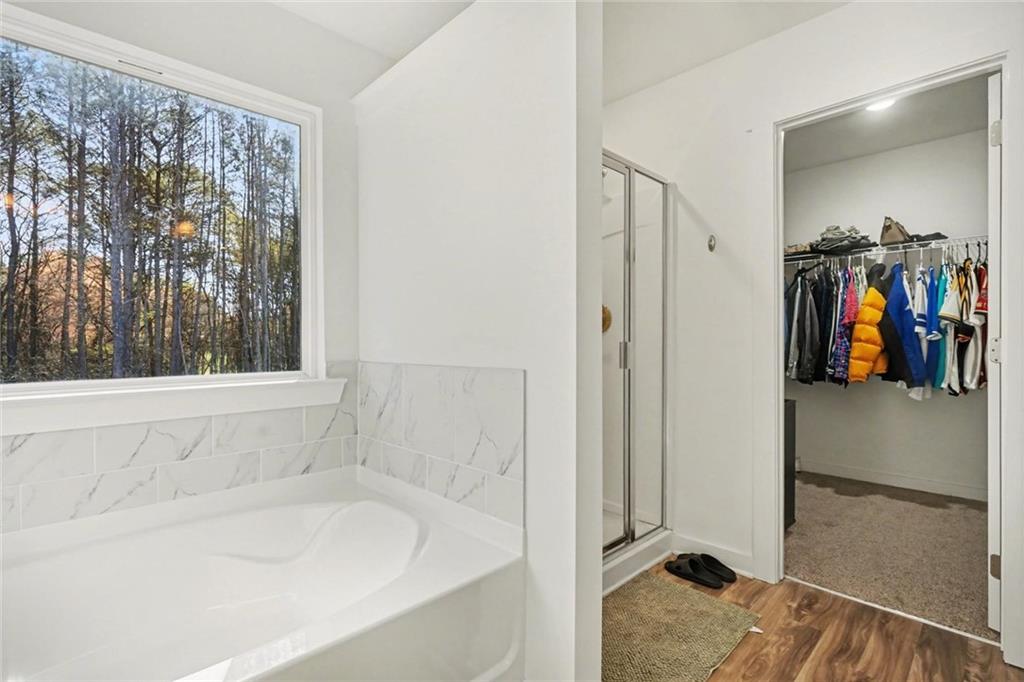 31 Breckens Way Statham, GA 30666 - Photo 18 of 24 a en suite spacious bathroom with a tub and shower
