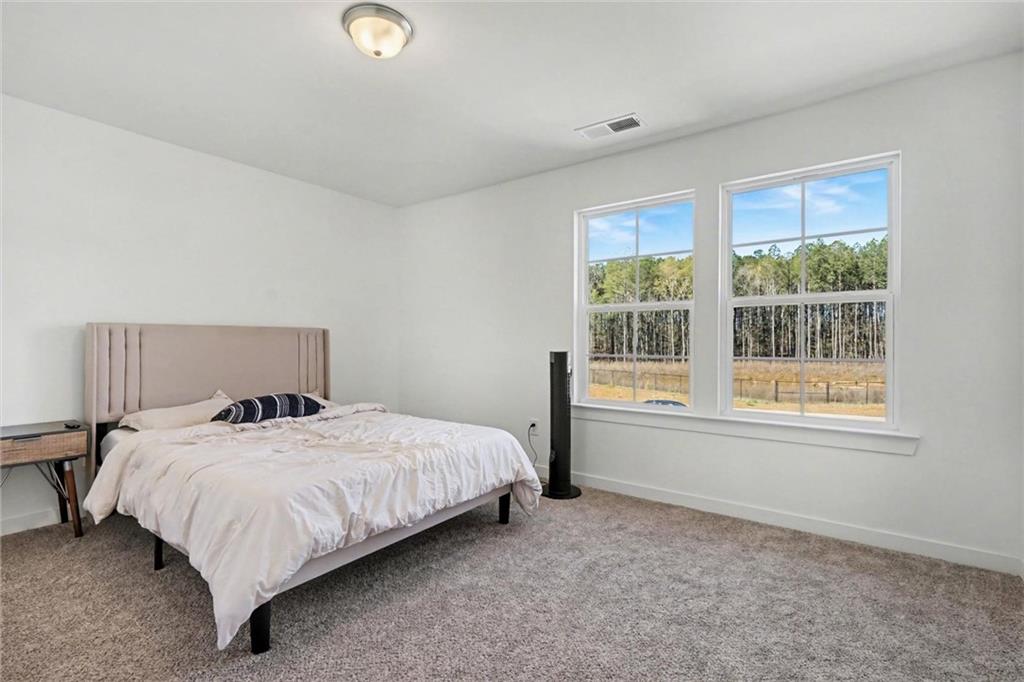 31 Breckens Way Statham, GA 30666 - Photo 19 of 24 a bedroom with a bed and window