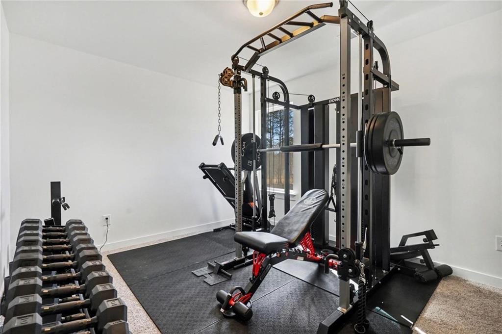 31 Breckens Way Statham, GA 30666 - Photo 20 of 24 a view of gym equipment with wooden floor