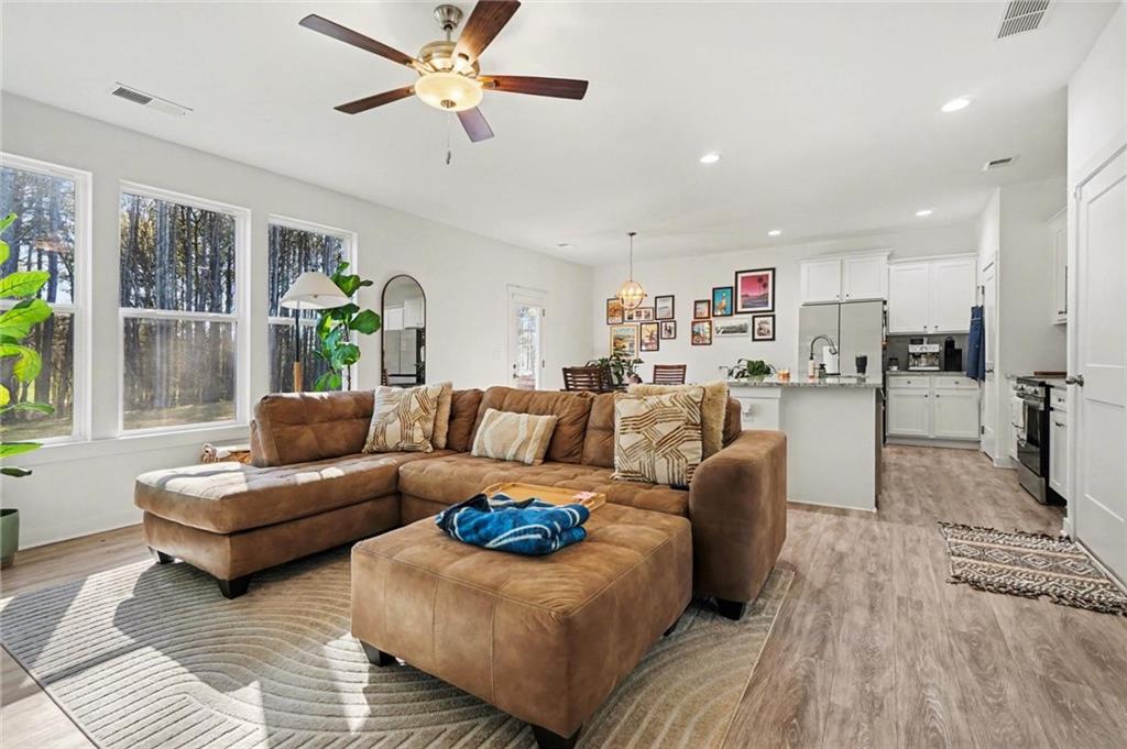 31 Breckens Way Statham, GA 30666 - Photo 7 of 24 a living room with furniture and a wooden floor