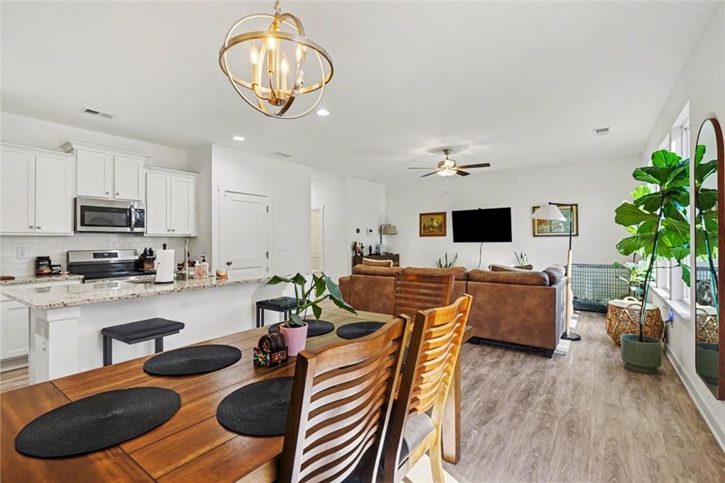 31 Breckens Way Statham, GA 30666 - Photo 9 of 24 a living room with furniture kitchen view and a large window