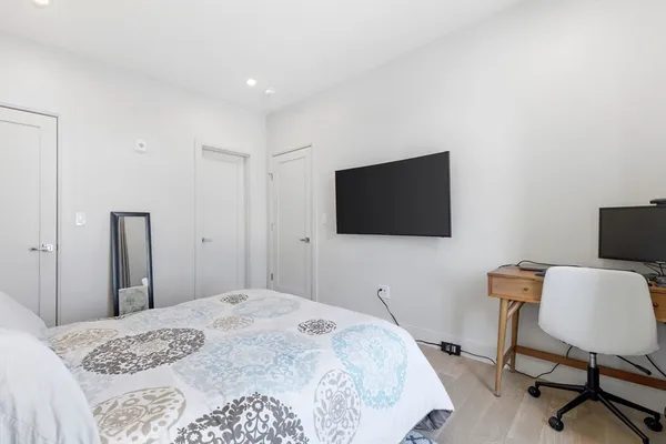 a bathroom with a granite countertop bathtub shower and toilet