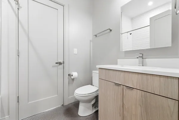 a bedroom with a bed a desk and chair