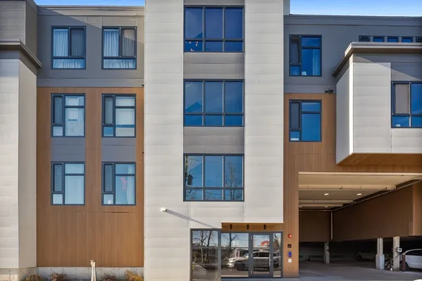a view of a street with buildings in the background