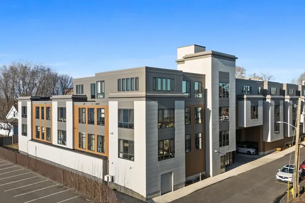 an aerial view of a house with lake view