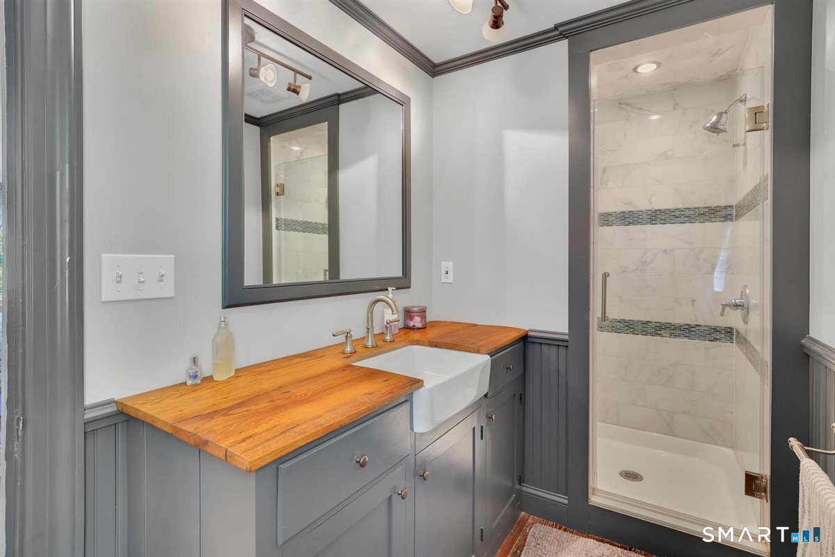 292 Parmelee Hill Road Durham, CT 06422 - Photo 27 of 39 Reclaimed barn wood is highlighted on the bathroom vanity