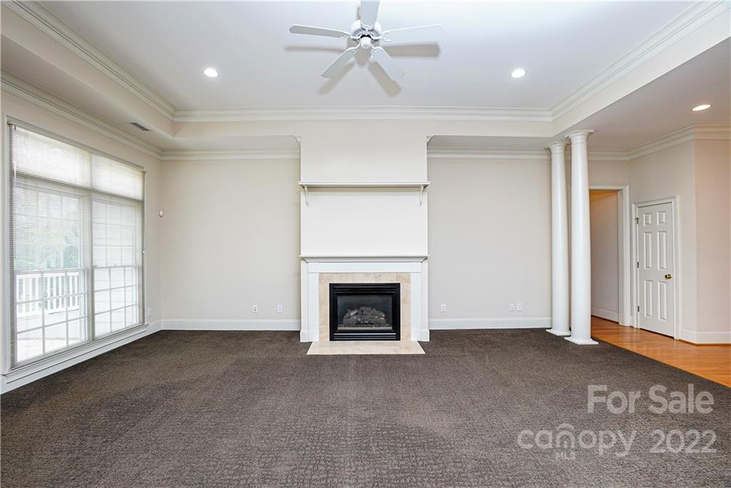 2586 Lower Assembly Drive Fort Mill, SC 29708 - Photo 16 of 48 an empty room with windows fireplace and fan