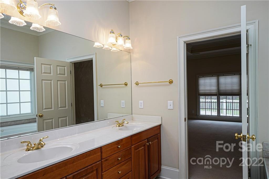 2586 Lower Assembly Drive Fort Mill, SC 29708 - Photo 28 of 48 a bathroom with a double vanity sink and a mirror