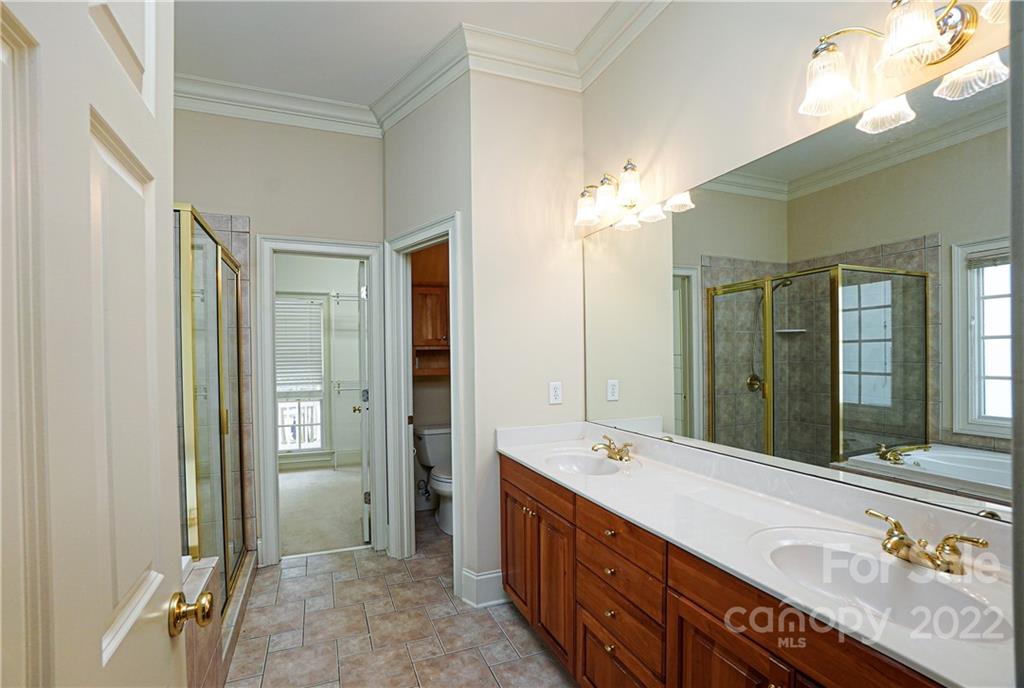2586 Lower Assembly Drive Fort Mill, SC 29708 - Photo 29 of 48 a spacious bathroom with a double vanity sink mirror and shower