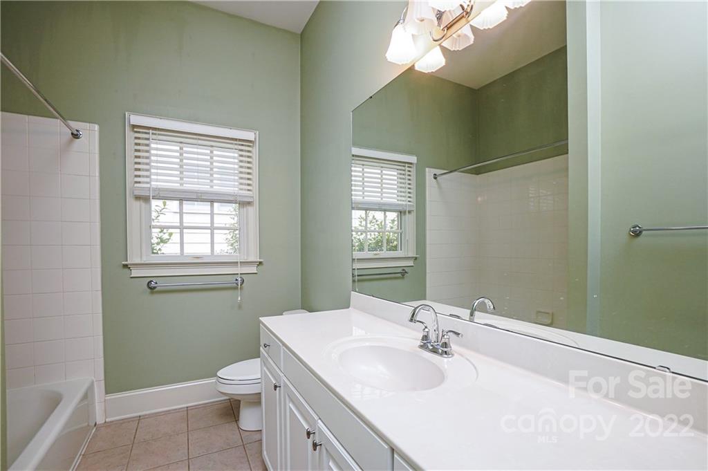 2586 Lower Assembly Drive Fort Mill, SC 29708 - Photo 42 of 48 a bathroom with a sink a toilet and a mirror