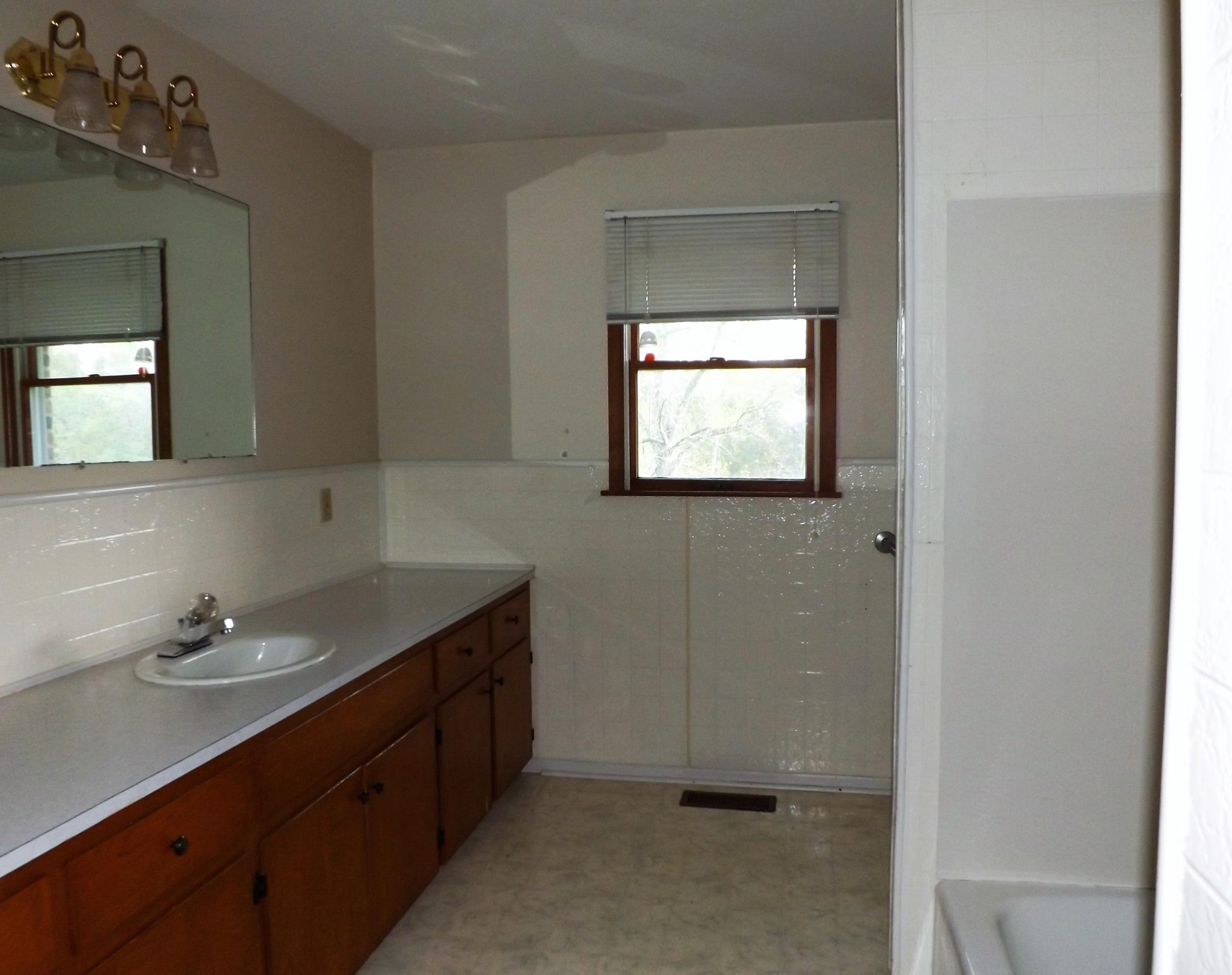 539 West Creston Road Crossville, TN 38571 - Photo 11 of 17 a bathroom with a double vanity sink and mirror