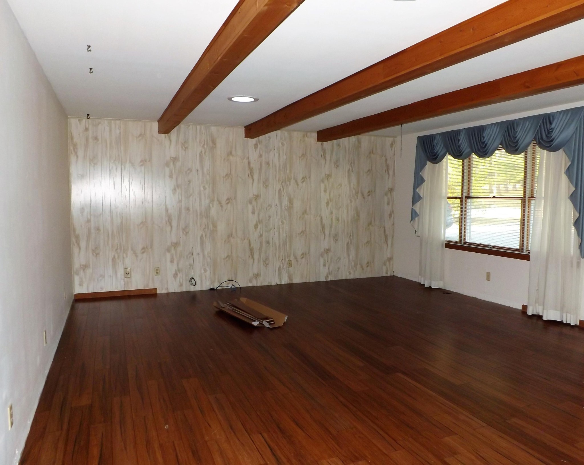 539 West Creston Road Crossville, TN 38571 - Photo 3 of 17 an empty room with wooden floor and windows