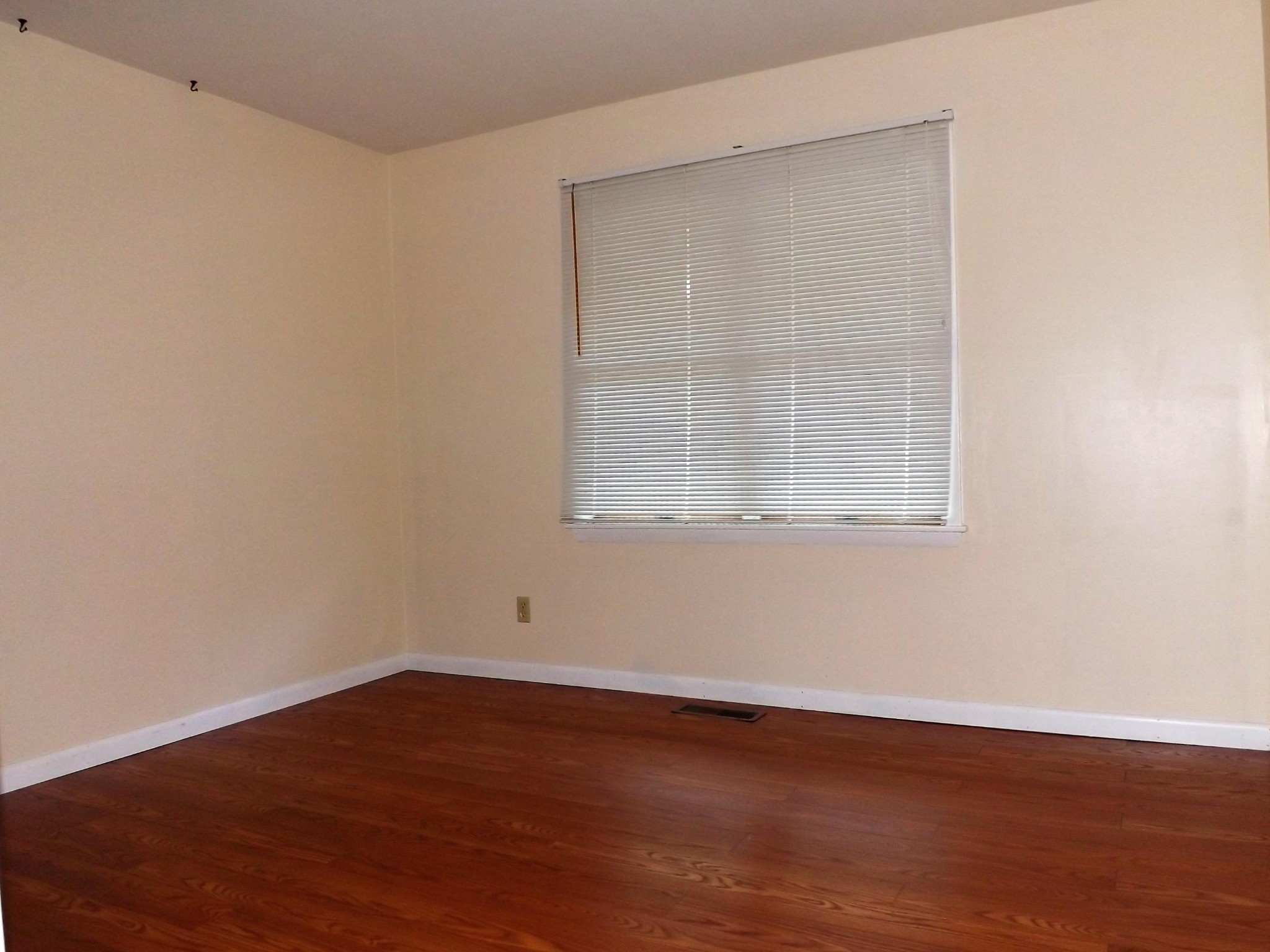 539 West Creston Road Crossville, TN 38571 - Photo 9 of 17 an empty room with wooden floor and windows