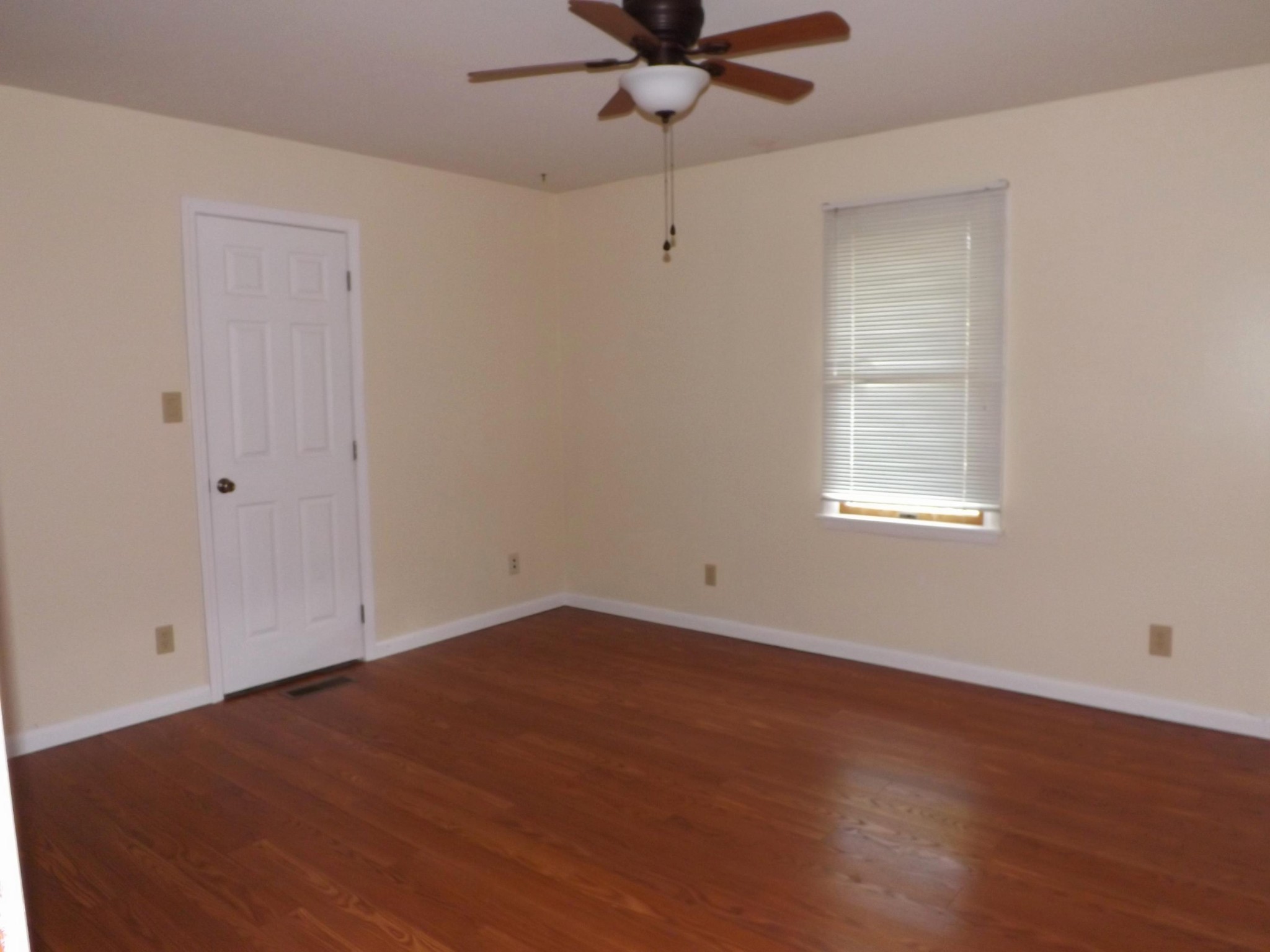 539 West Creston Road Crossville, TN 38571 - Photo 10 of 17 wooden floor in an empty room with a window