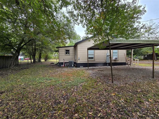 a house view with a backyard space