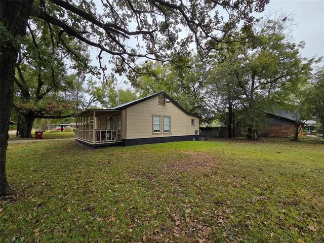 a house with trees in front of it
