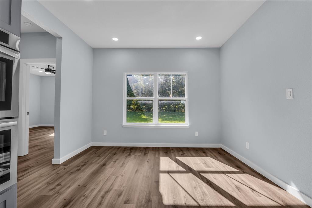 308 Crye Circle Robinson, TX 76706 - Photo 12 of 37 an empty room with wooden floor and a window