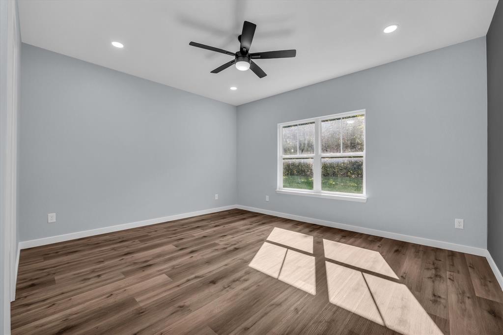 308 Crye Circle Robinson, TX 76706 - Photo 16 of 37 a view of an empty room with wooden floor and a window