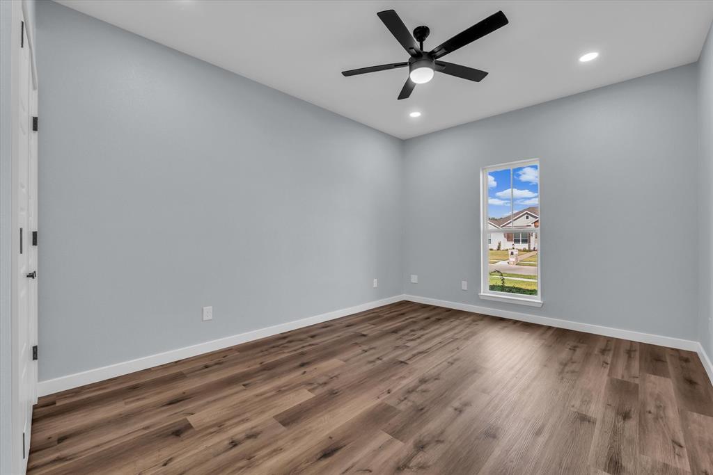 308 Crye Circle Robinson, TX 76706 - Photo 27 of 37 an empty room with wooden floor and windows