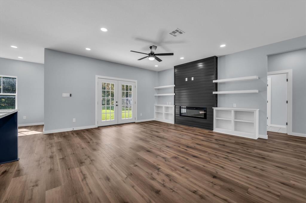 308 Crye Circle Robinson, TX 76706 - Photo 6 of 37 a view of a room with wooden floors and ceiling fan