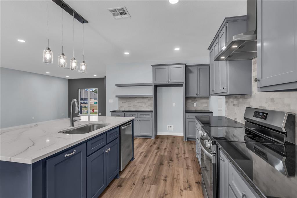 308 Crye Circle Robinson, TX 76706 - Photo 9 of 37 a kitchen with a sink stainless steel appliances and window