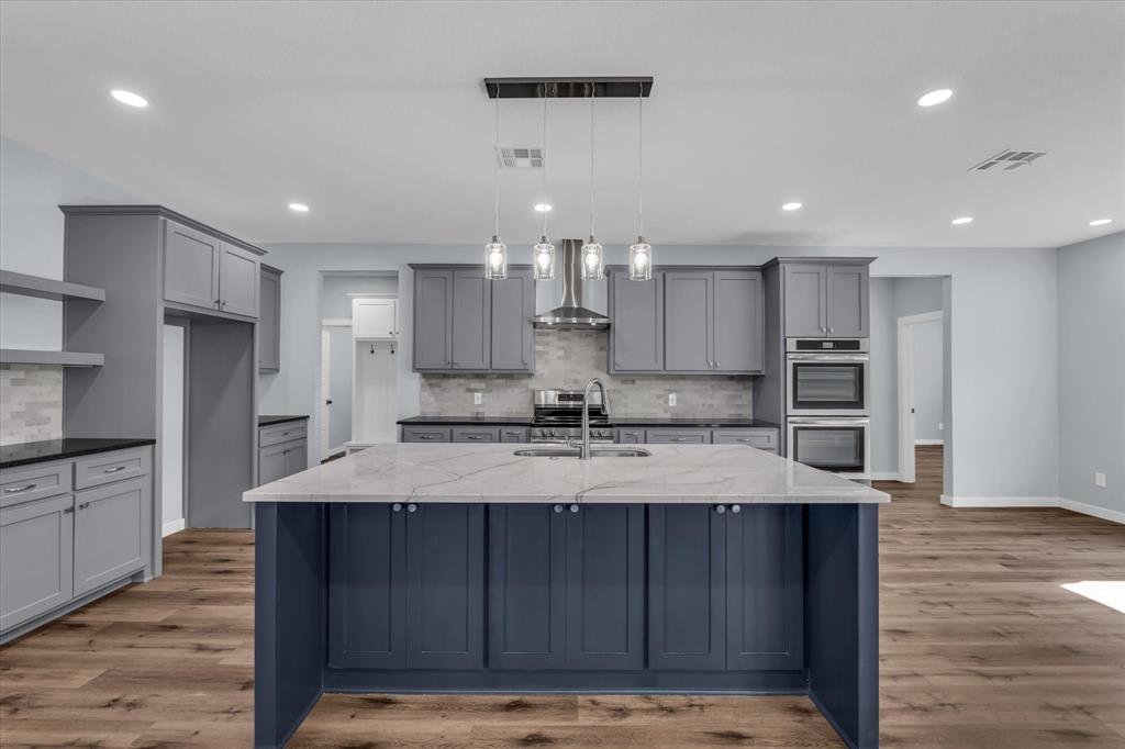 308 Crye Circle Robinson, TX 76706 - Photo 10 of 37 a large kitchen with kitchen island a sink stainless steel appliances and cabinets