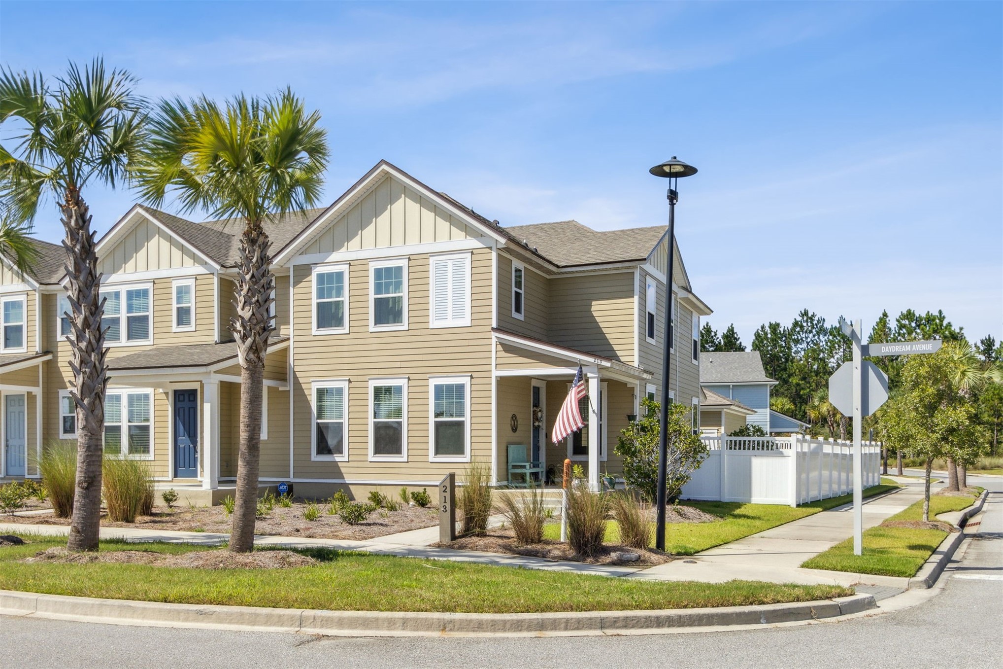 213 Daydream Avenue Yulee, FL 32097 - Photo 1 of 40 a front view of a house with garden