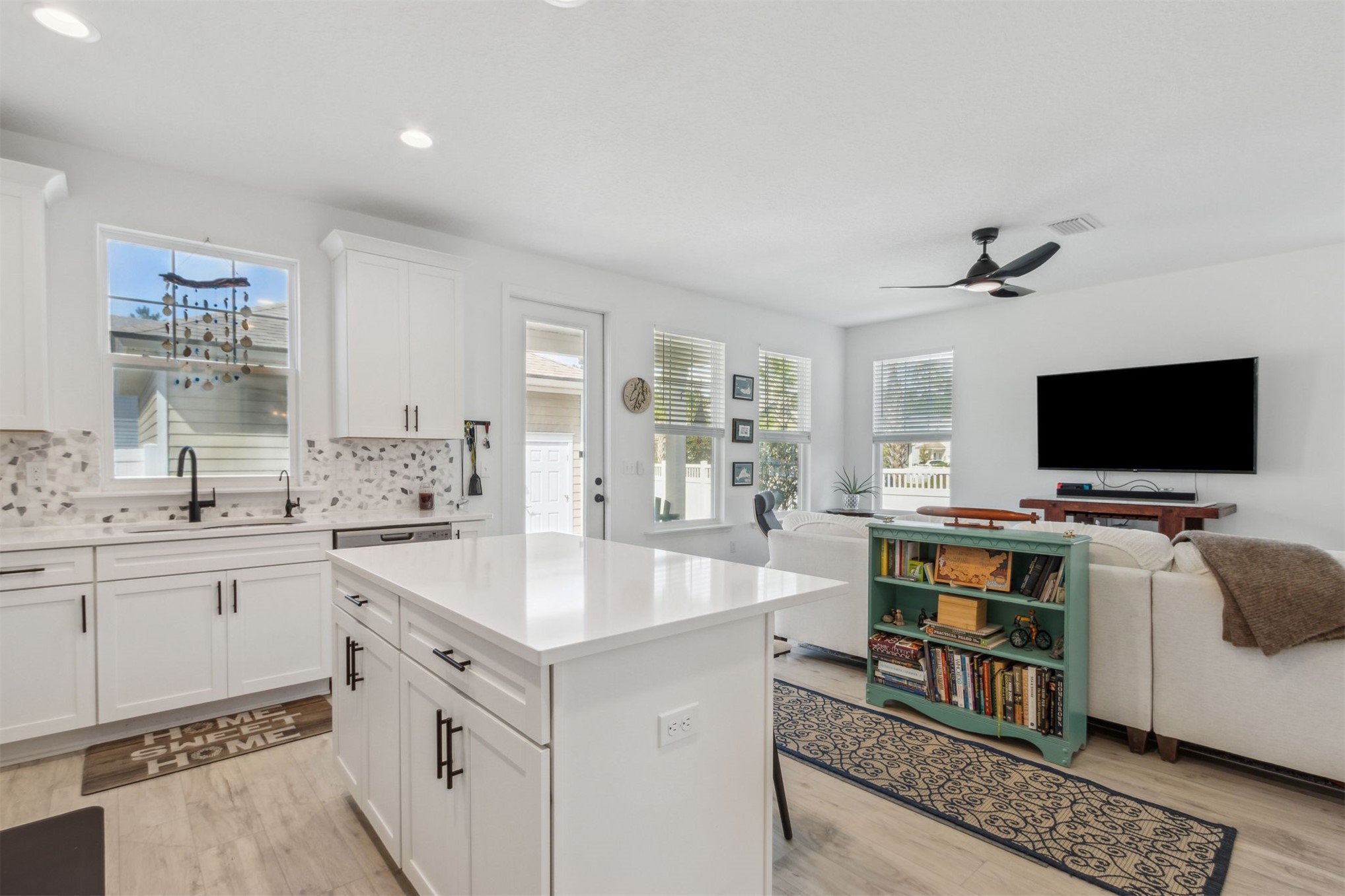 213 Daydream Avenue Yulee, FL 32097 - Photo 12 of 40 a open kitchen with cabinets a sink and appliances