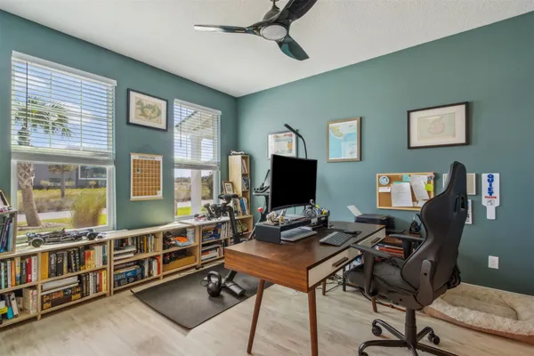 a bathroom with a toilet a sink and a window