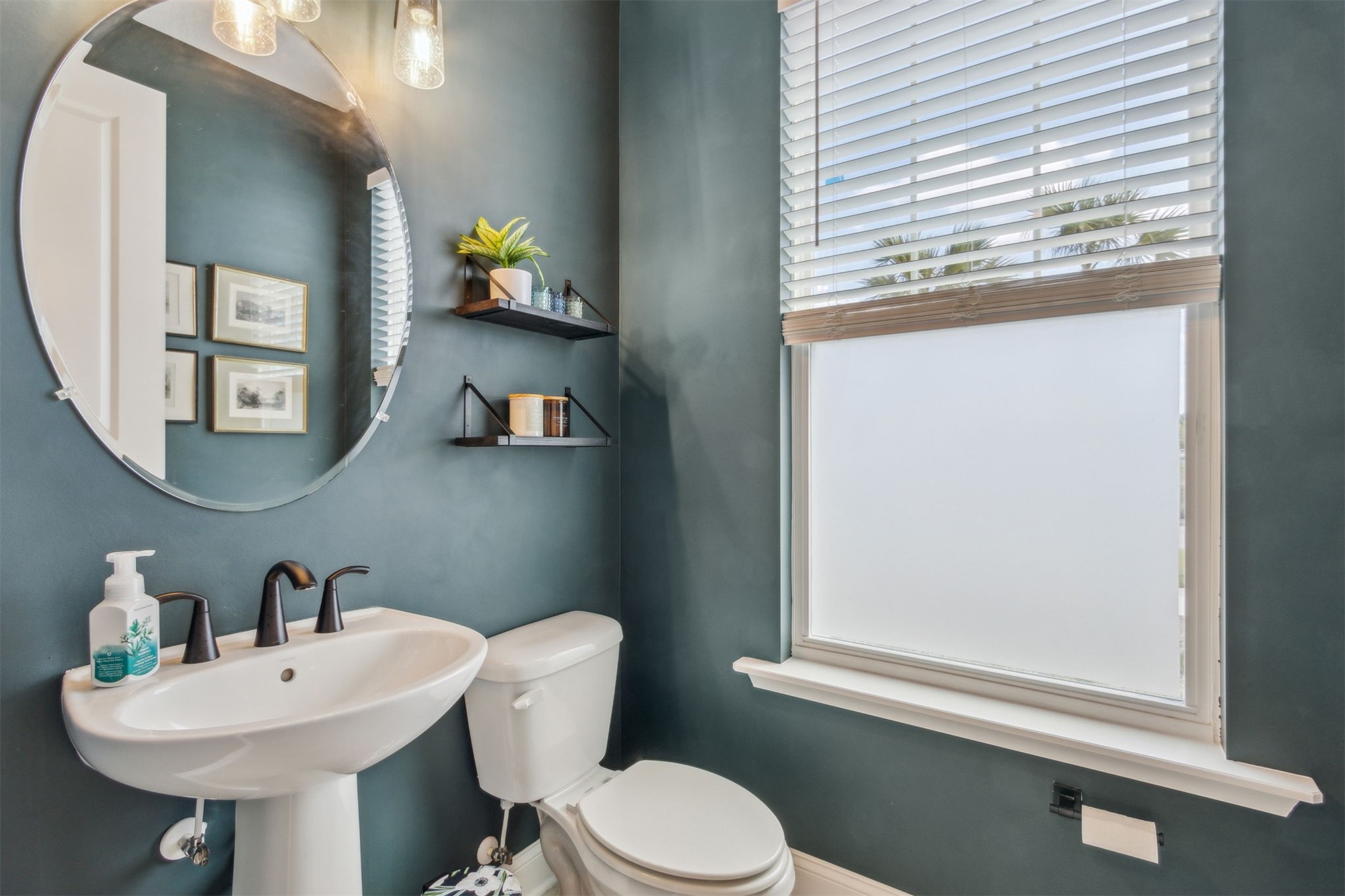 213 Daydream Avenue Yulee, FL 32097 - Photo 15 of 40 a bathroom with a toilet a sink and a window