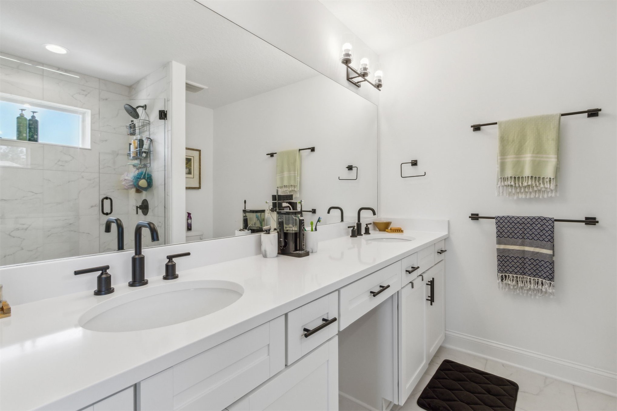 213 Daydream Avenue Yulee, FL 32097 - Photo 21 of 40 a bathroom with a sink and a mirror