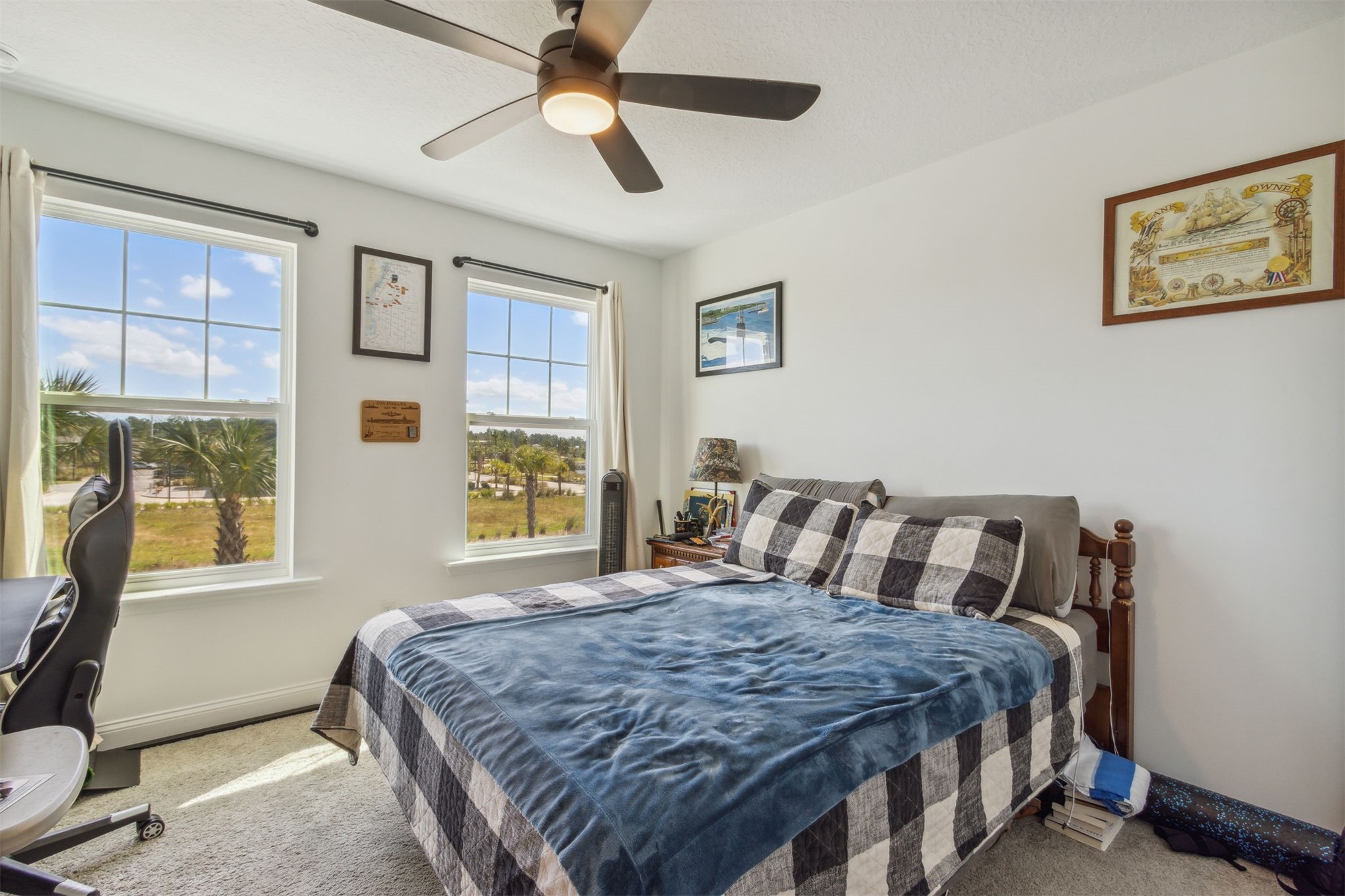 213 Daydream Avenue Yulee, FL 32097 - Photo 22 of 40 a bedroom with a large bed and a window