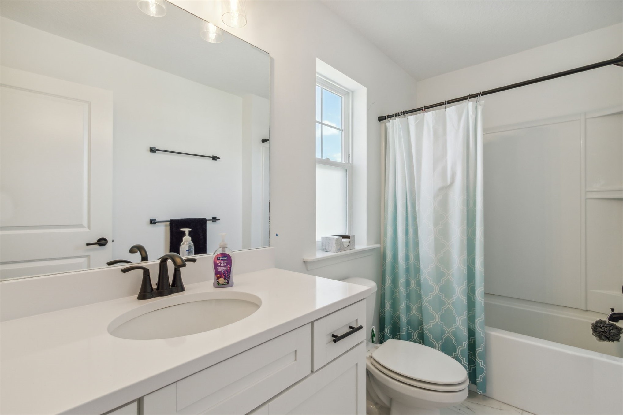 213 Daydream Avenue Yulee, FL 32097 - Photo 25 of 40 a bathroom with a sink a toilet and shower