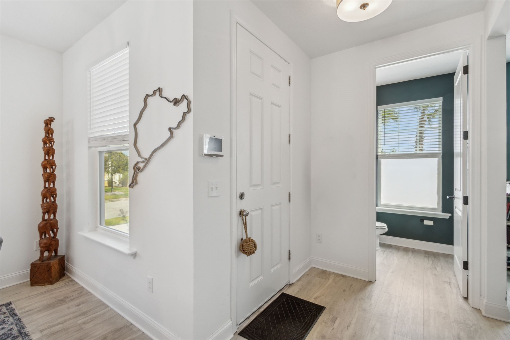 213 Daydream Avenue Yulee, FL 32097 - Photo 3 of 40 a view of an entryway with wooden floor