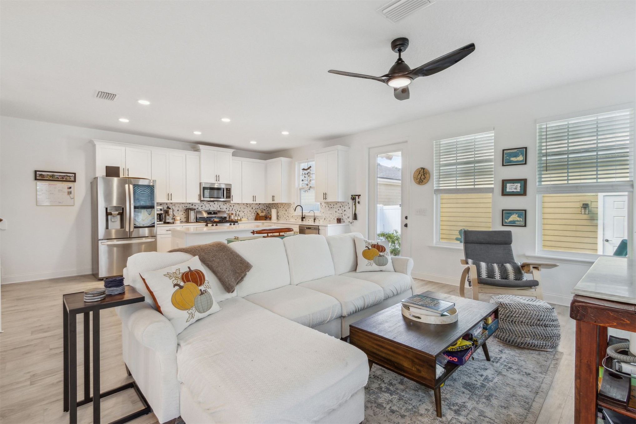 213 Daydream Avenue Yulee, FL 32097 - Photo 8 of 40 a living room with furniture kitchen view and a window