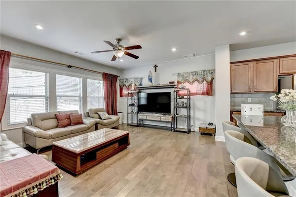 a living room with furniture and a flat screen tv