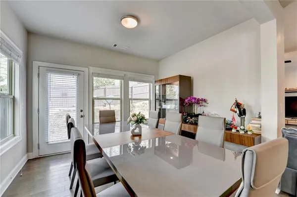 a view of a dining room with furniture window and outside view