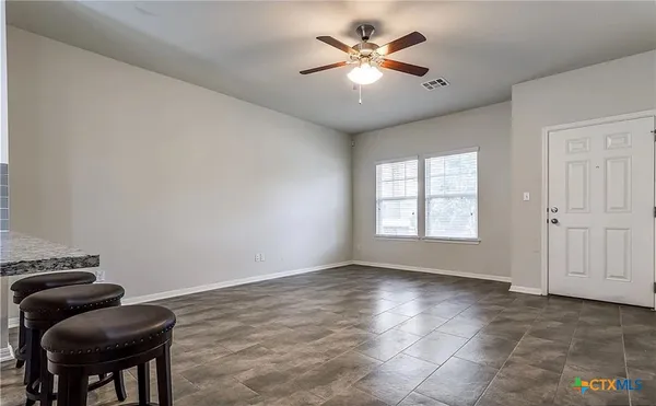 a view of workspace with furniture and window