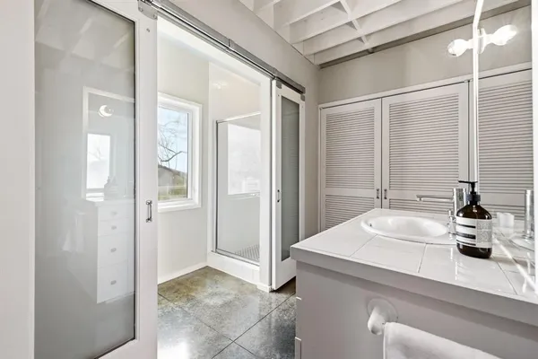 a bathroom with a sink and a mirror