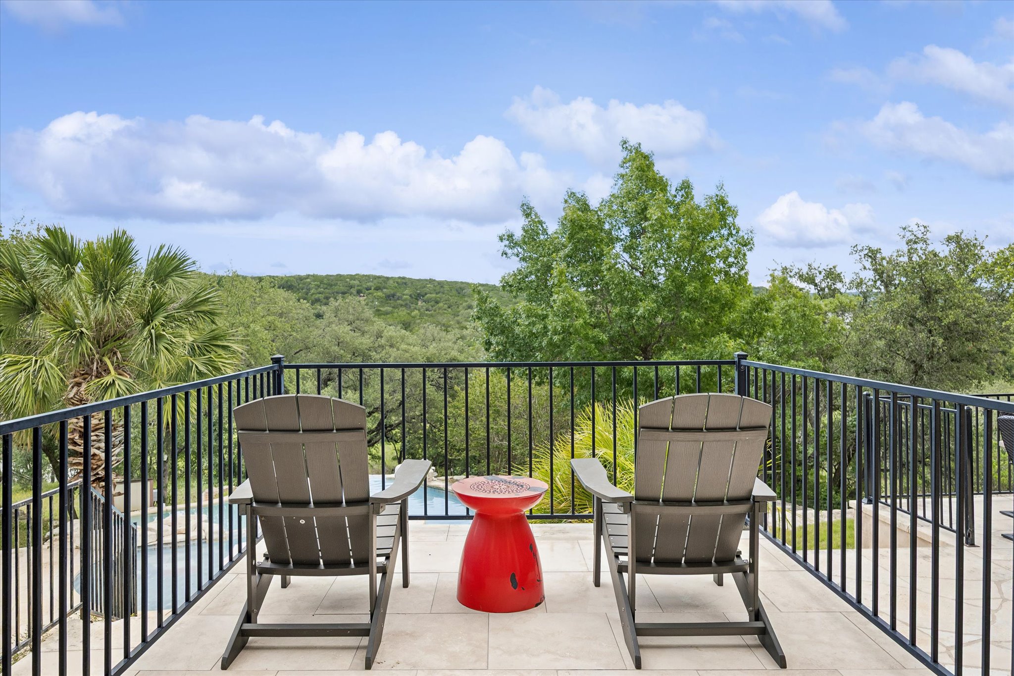 3719 Bee Creek Road Spicewood, TX 78669 - Photo 31 of 40 Perched above the tree-lined hills, a tiled deck provides sweeping vistas and a tranquil retreat.
