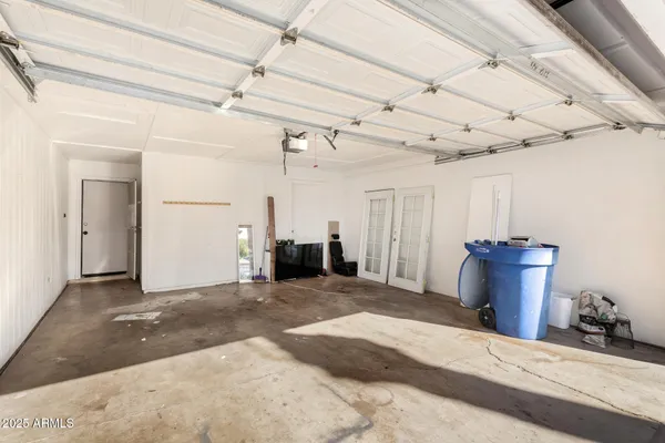 a view of a room with furniture and a window