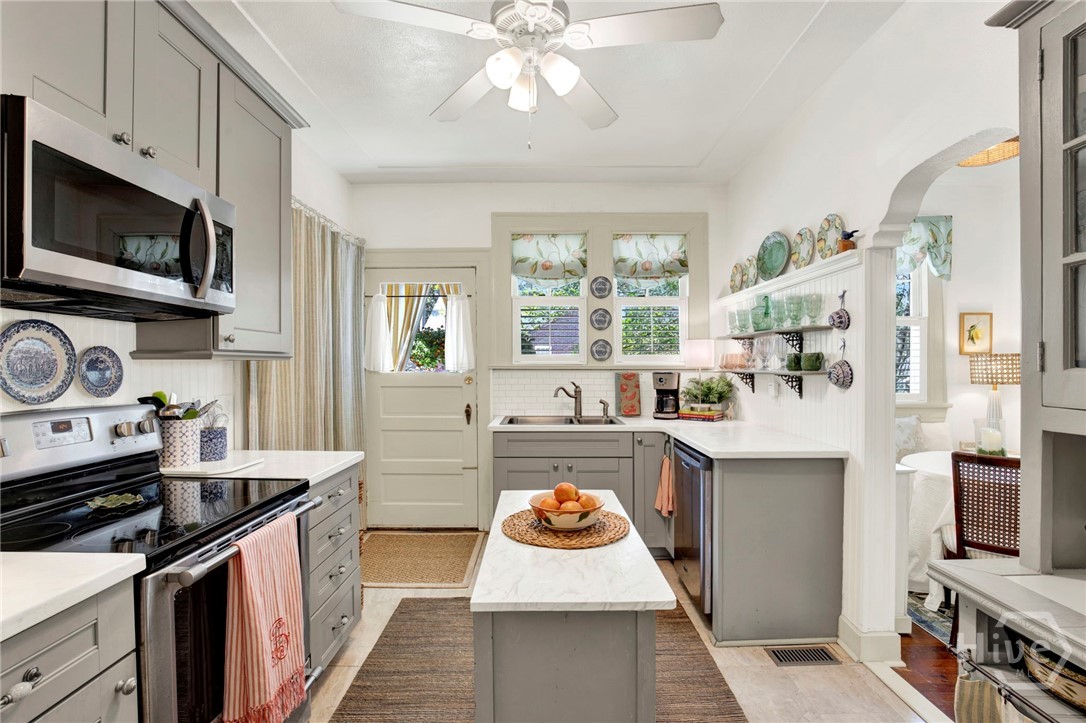 301 East 56th Street Savannah, GA 31405 - Photo 13 of 47 Bright, updated kitchen featuring abundant cabinetry, modern finishes, and a functional layout ideal for everyday cooking and entertaining.