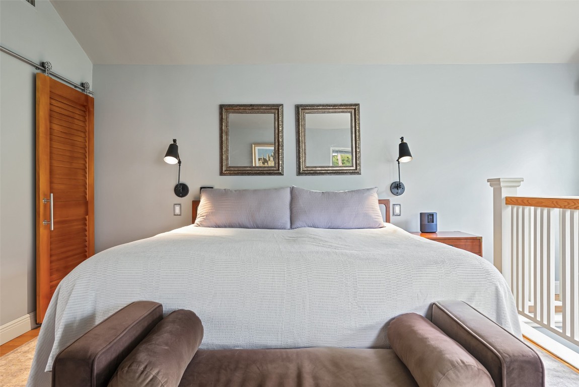 2208 Mountain View Road Austin, TX 78703 - Photo 21 of 39 a bedroom with a bed and window