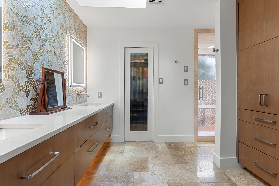 2208 Mountain View Road Austin, TX 78703 - Photo 23 of 39 a bathroom with a sink and a mirror