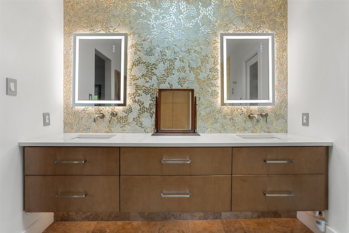 2208 Mountain View Road Austin, TX 78703 - Photo 24 of 39 a bathroom with a sink and a mirror