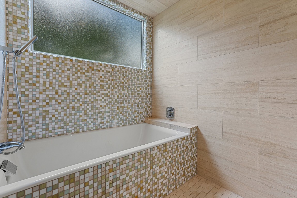 2208 Mountain View Road Austin, TX 78703 - Photo 25 of 39 a bathroom with a bathtub and shower
