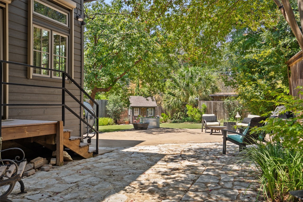 2208 Mountain View Road Austin, TX 78703 - Photo 31 of 39 a view of a patio with table and chairs and wooden fence