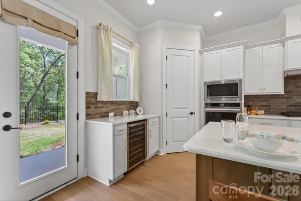 a kitchen with a sink stove and refrigerator